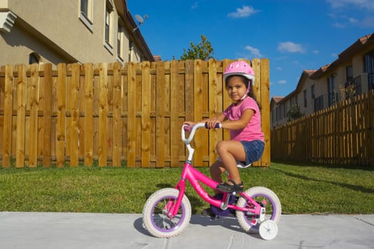 Portrait of a girl riding a bicycle on a path