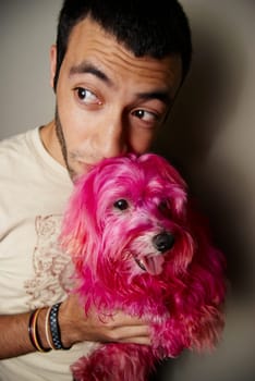 Man with hot pink dog