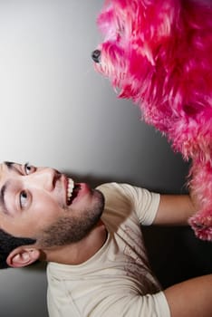 Man with hot pink dog