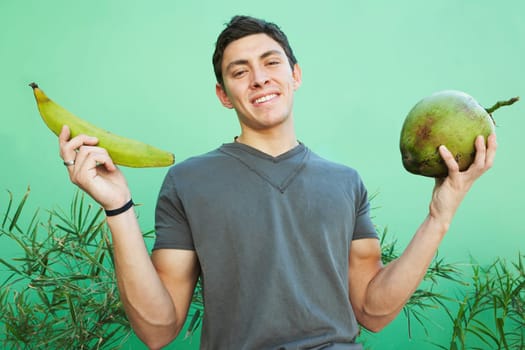 Young man holding fruit