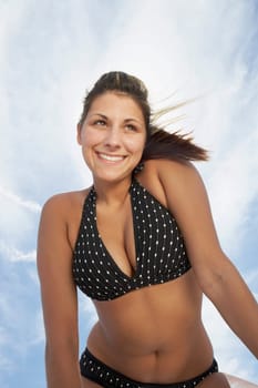 Low angle view of a young woman smiling
