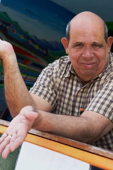 Portrait of a senior man leaning on a railing