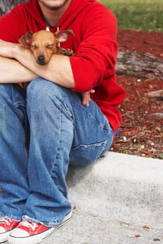 Low section view of a man with his pet