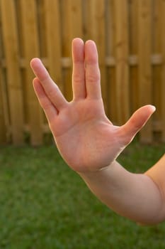 Close-up of a woman's hand making a hand sign