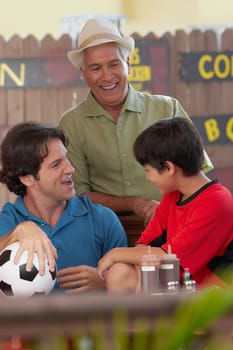 Mid adult man with his father and his son in a restaurant