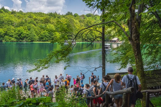 Plitvicka Jezera, Croatia, July 2019 Massive crowds and queues for ferry to cross the lake in Plitvice Lakes National Park UNESCO World Heritage
