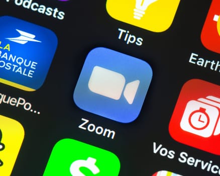 BAYONNE, FRANCE - CIRCA JANUARY 2021: Zoom app icon on Apple iPhone screen. Zoom is software program for video and audio conferencing, chat, and webinars.