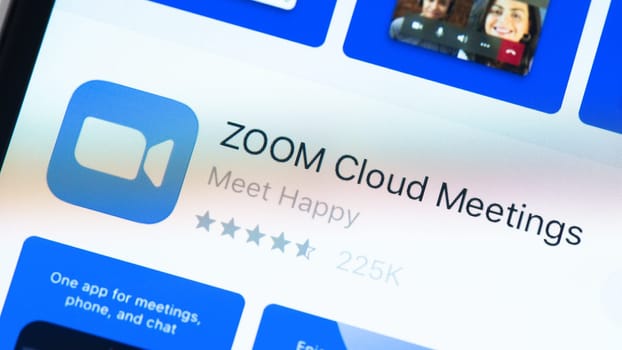 BAYONNE, FRANCE - CIRCA JANUARY 2021: Zoom app page in the App Store on Apple iPhone screen. Zoom is software program for video and audio conferencing, chat, and webinars.