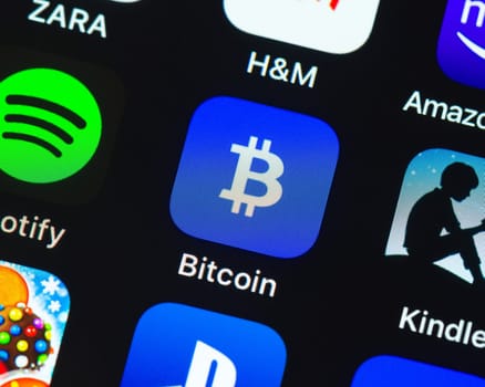 BAYONNE, FRANCE - CIRCA JANUARY 2021: Bitcoin Wallet app icon on Apple iPhone screen. Bitcoin Wallet is a cryptocurrency trading app.