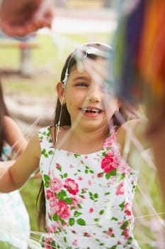 Close-up of a girl smiling at a birthday party