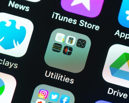 BAYONNE, FRANCE - CIRCA JANUARY 2021: Utilities folder app icon on Apple iPhone screen. Five apps in the folder.
