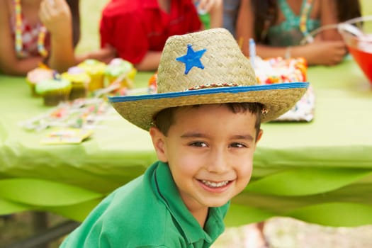 Close-up of a boy smiling at a birthday party