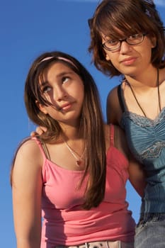 Low angle view of a teenage girl standing with her sister