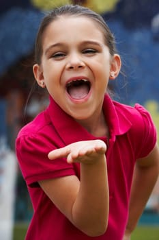 Portrait of a girl blowing kisses