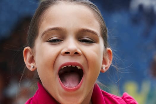 Portrait of a girl with her mouth open