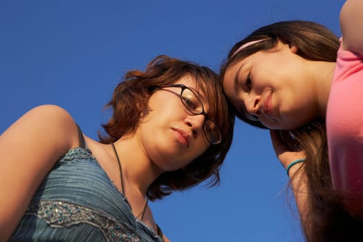 Low angle view of a teenage girl with her sister