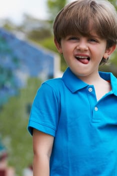Portrait of a boy sticking his tongue out