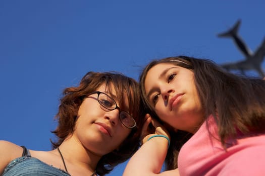 Low angle view of a teenage girl with her sister