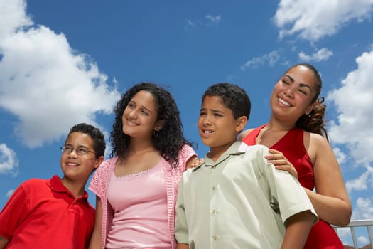 Close-up of two boys and two teenage girls smiling