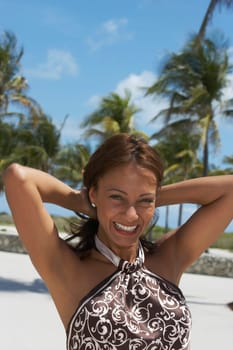 Portrait of a mature woman smiling on the beach, South Beach, Miami Beach, Florida, USA
