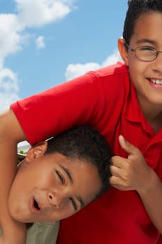 Close-up of a boy pulling the hair of another boy