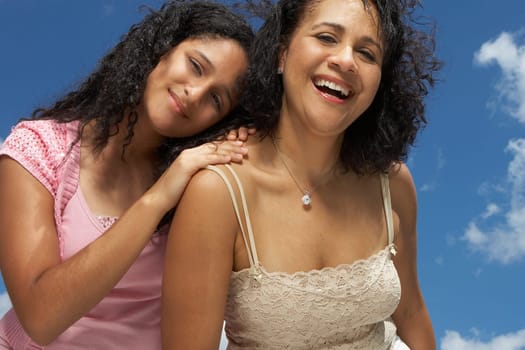 Portrait of a mature woman laughing with her daughter