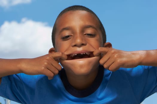 Portrait of a boy making a face
