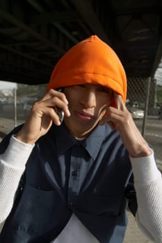 Portrait of a young man talking on a mobile phone