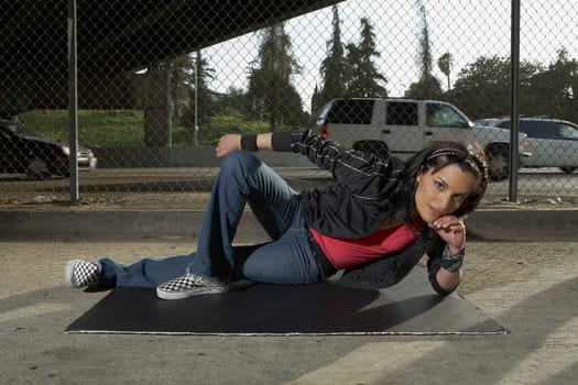 Portrait of a young woman posing on a mat