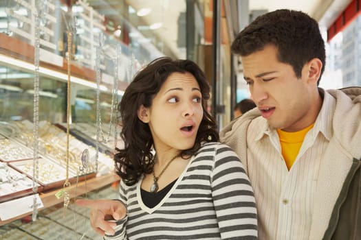 Close-up of a young couple in a jewelry store