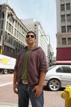 Young man standing on the road