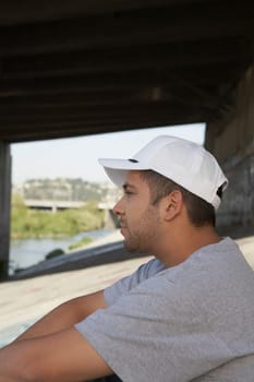 Side profile of a young man thinking