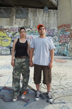 Portrait of a young couple holding each other's hand