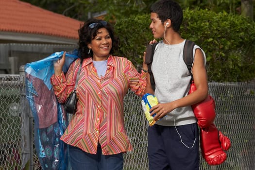 Mature woman and her son standing and talking