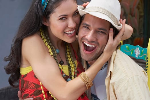 Portrait of a young couple embracing each other and smiling