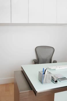 Calculator with a desk organizer on a table