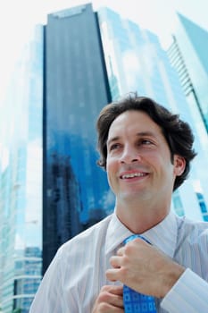Businessman adjusting his tie