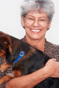 Portrait of a senior woman holding her pets