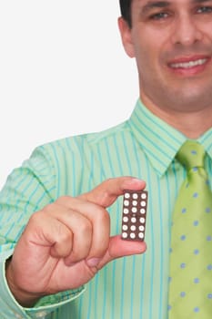 Front view of a businessman holding a domino and smiling