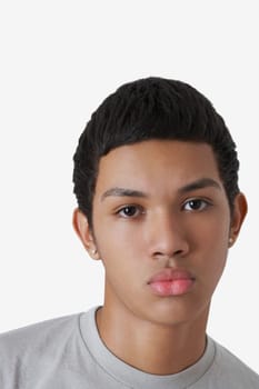 Portrait of a teenage boy puckering