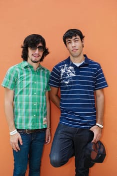 Portrait of two young men standing together