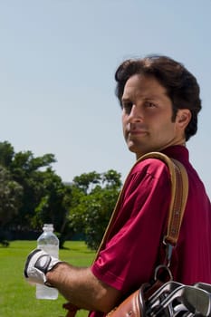 Portrait of a mid adult man holding a water bottle