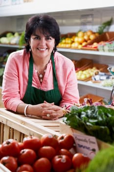Portrait of a mature woman in a store and smiling