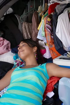 Close-up of a young woman sleeping in a car