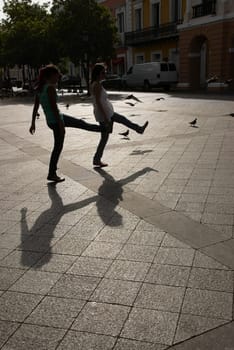 Side profile of two young women walking