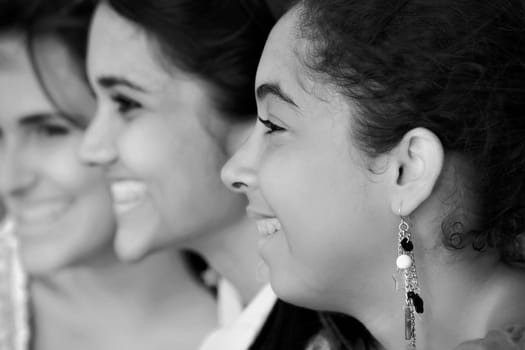 Close-up of three young women smiling