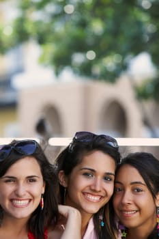 Close-up of three young women smiling