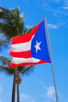 Low angle view of a Puerto Rican flag fluttering, Luquillo Beach, Puerto Rico