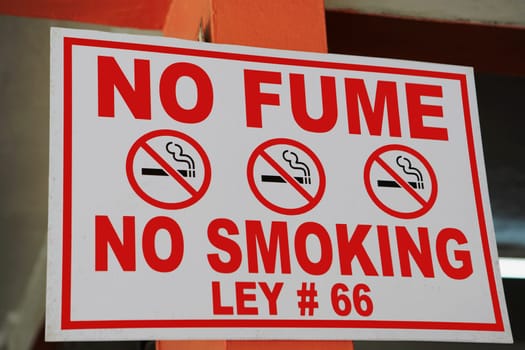 Close-up of a No Smoking signboard
