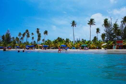 Group of people on the beach, Luquillo Beach, Puerto Rico